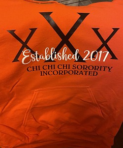 Orange Chi Hoodie with 3 Black Xs and white cursive script on top, Established 2017. Black lettering. Chi Chi Chi Sorority Incorporated